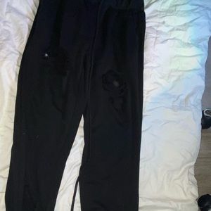 holed black sweatpants